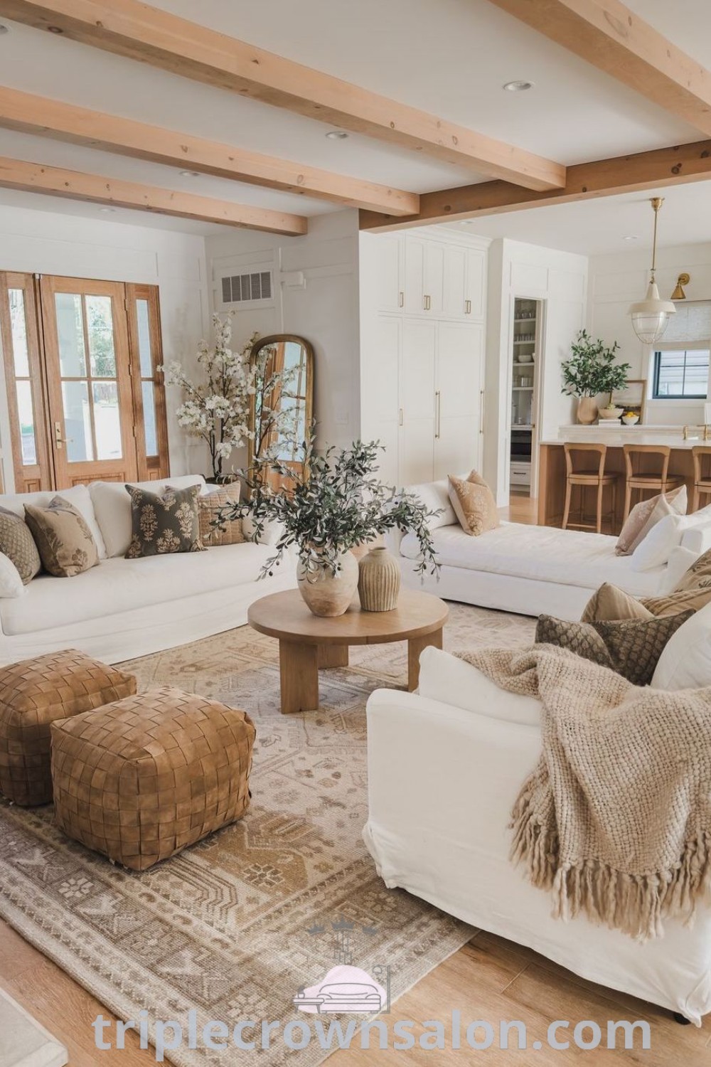 A cozy farmhouse living room filled with stylish furniture and decor ideas, showcasing modern farmhouse designs and wall decor inspirations. This inviting space is perfect for those seeking cozy home ideas and decor tips. Discover more unique design ideas at triplecrownsalon.com.