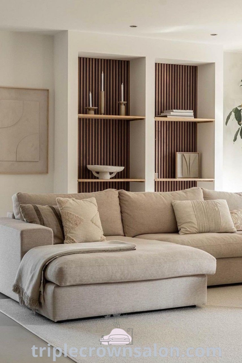 A modern living room featuring a large sectional couch in a Japandi style, showcasing neutral colors and minimalistic decor ideas, creating a cozy aesthetic for your home. Explore unique design tips for small spaces and more inspirations at triplecrownsalon.com.