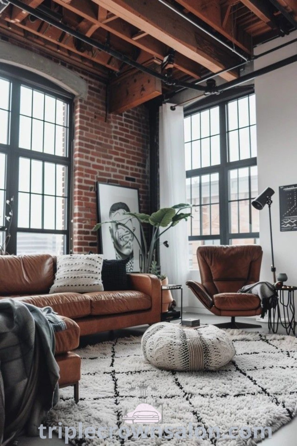 A cozy Scandinavian industrial living room featuring large windows, stylish furniture, and a warm rug that enhances the inviting atmosphere. This space showcases unique ideas for your home, perfect for a boys apartment or high-rise living. Discover more decor ideas at triplecrownsalon.com.