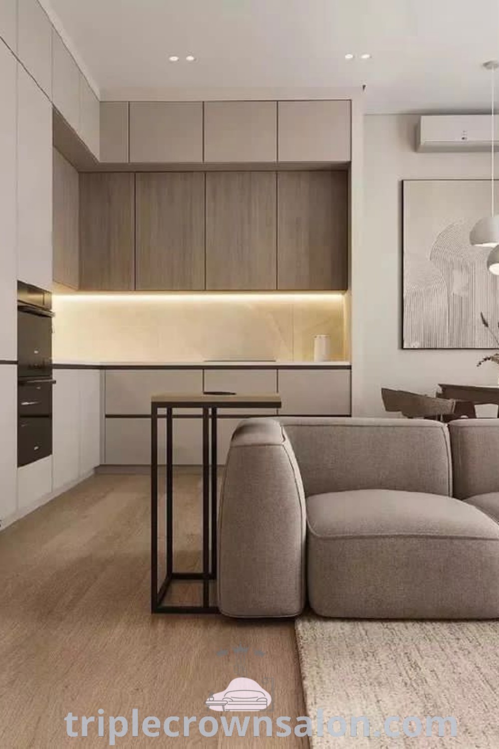 A modern and minimalist kitchen design integrated into a living room setting, showcasing functional decor ideas and cozy aesthetics. This multifunctional space is perfect for small apartments and entertaining, providing unique design inspirations. Explore more decor ideas at triplecrownsalon.com.