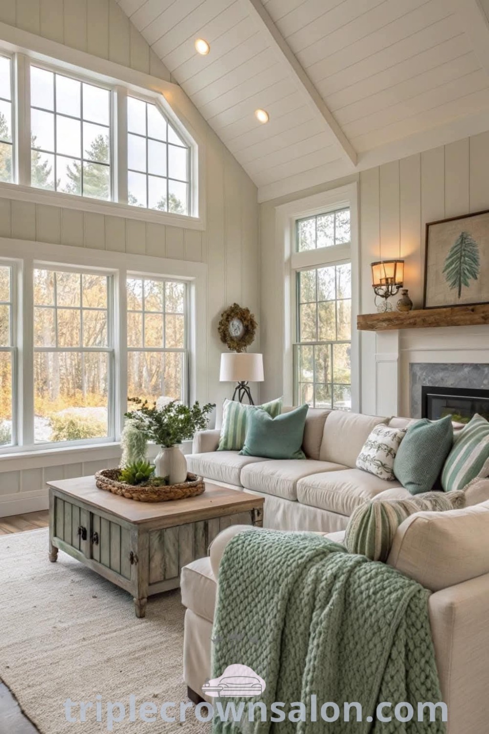 A cozy farmhouse living room filled with furniture and natural light, featuring Farmhouse Green accents and inviting decor ideas. This space highlights modern farmhouse living trends and country cottage inspirations, making it ideal for a cozy home experience. Discover more ideas at triplecrownsalon.com.