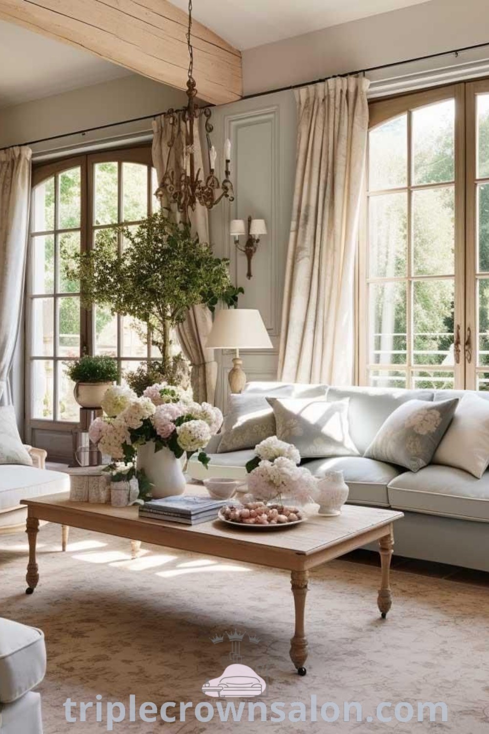 A cozy French Provincial living room filled with furniture, vibrant flowers on a coffee table, and inviting decor ideas for a modern French country style. This scene embodies unique inspirations for your home and offers design tips to create a warm, charming atmosphere. Explore more at triplecrownsalon.com.