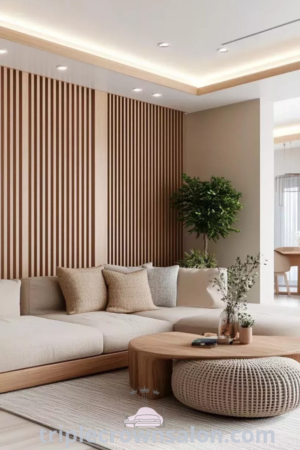 A minimalist Japandi living room showcasing a cozy couch, coffee table, and a potted plant, illustrating perfect decor ideas for small spaces. This serene design blends Japanese and Scandinavian styles, creating an inviting atmosphere. For more inspiring decor inspirations, visit triplecrownsalon.com.