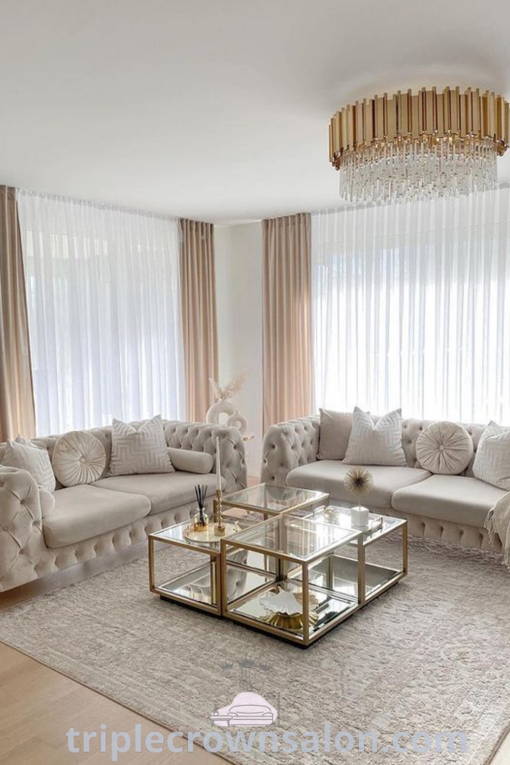 A glamorous gold living room filled with chic furniture and a beautiful chandelier, ideal for creating a classy bedroom or a cozy women cave. This space showcases unique ideas and decor inspirations for a stylish home. Discover more design ideas at wellnesswink.com.
