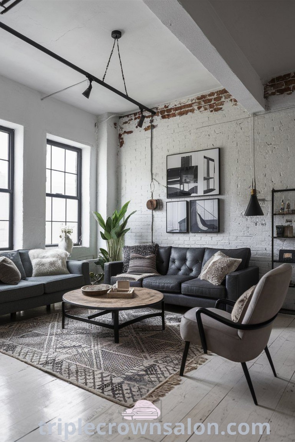 An urban modern living room filled with furniture, large windows, and soft industrial decor, showcasing mid-century and industrial chic elements. This inviting space offers unique ideas for small apartments and cozy home inspirations. Discover more at triplecrownsalon.com.