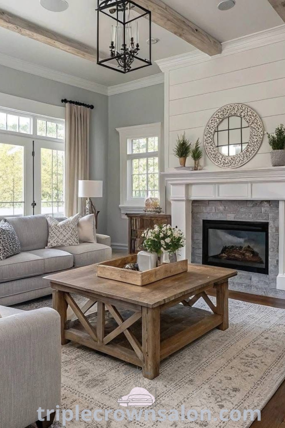 A cozy farmhouse living room filled with inviting furniture and a stylish fireplace, showcasing warm decor ideas perfect for family gatherings. This inspiring space combines comfort and style, offering unique design ideas for your home. Find more cozy inspirations at triplecrownsalon.com.