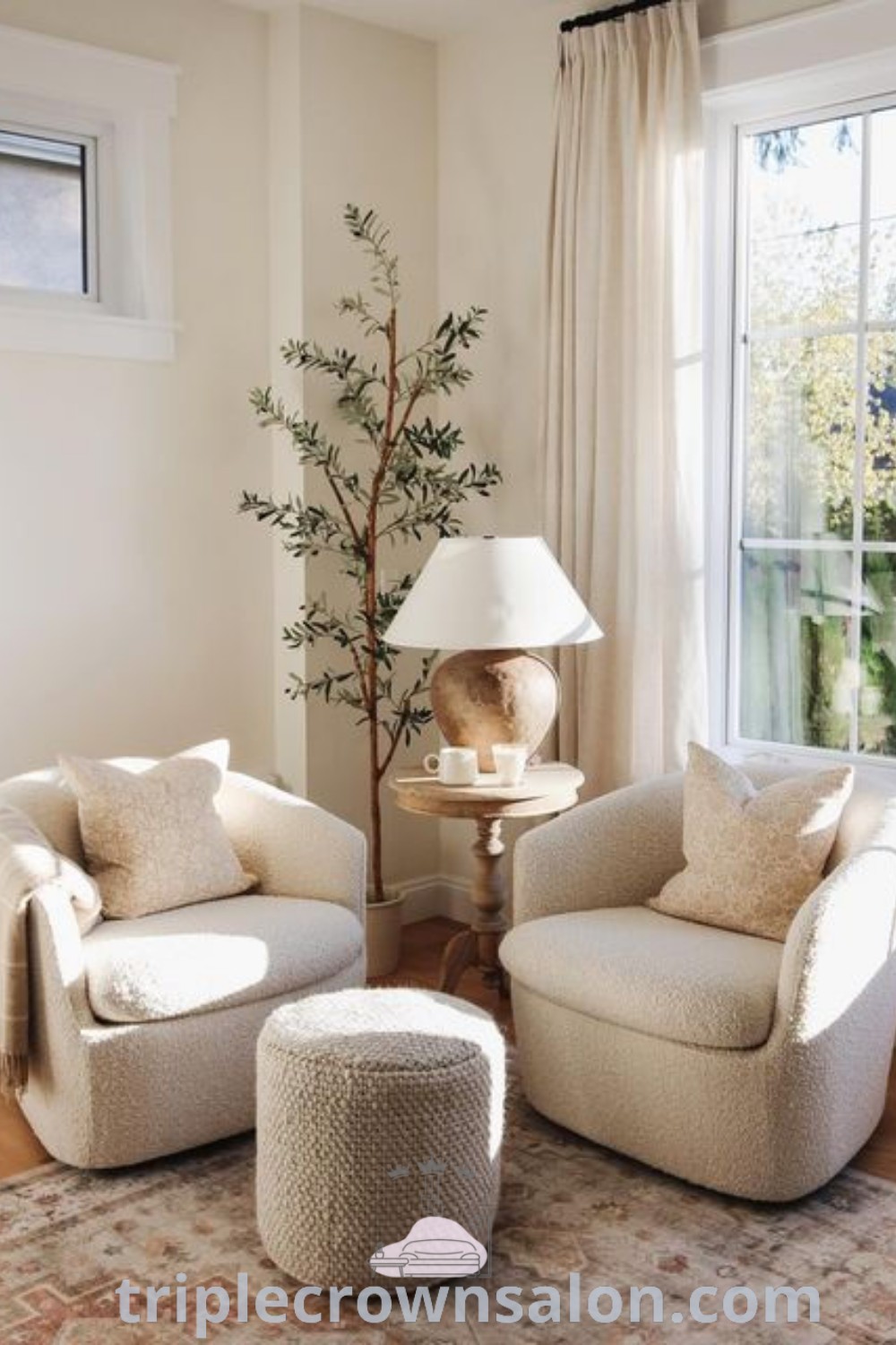 A cozy Scandinavian living room with two stylish chairs and a table in front of a large window, showcasing an inviting atmosphere. This space highlights decor ideas for small living rooms, offering inspirations that blend comfort and function. Find more cozy home design ideas at triplecrownsalon.com.