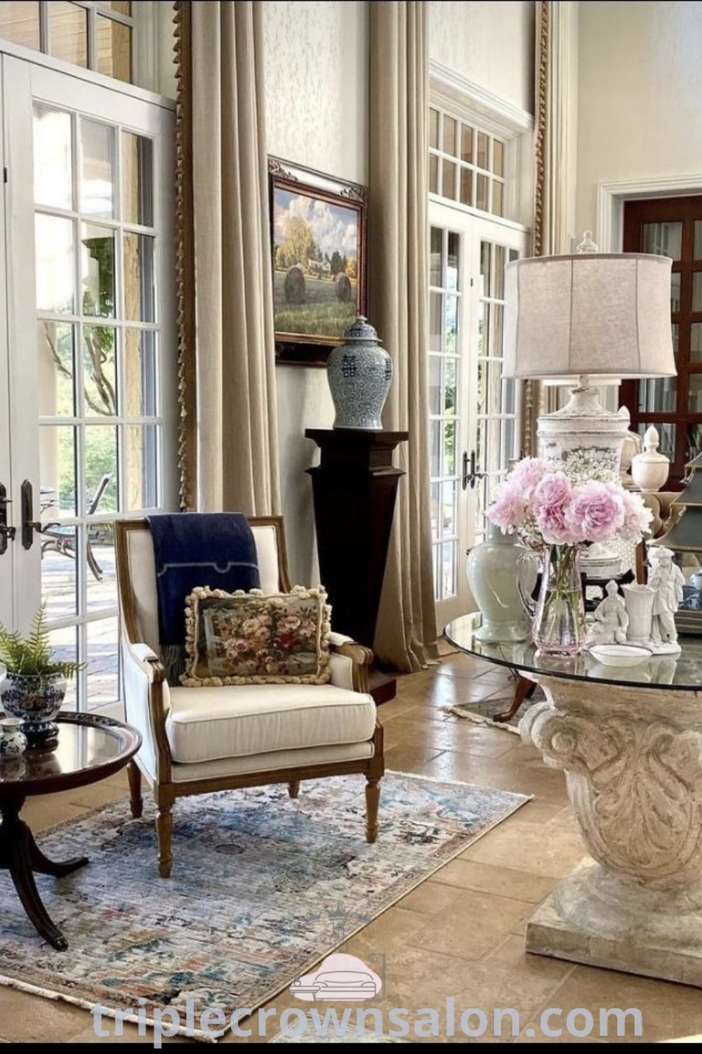 A stylish cream and gold living room filled with natural light, featuring elegant furniture and decor ideas that reflect classic interior design trends. This inviting space showcases a cozy aesthetic and inspiring decor inspirations for your home. Visit triplecrownsalon.com for more design ideas.