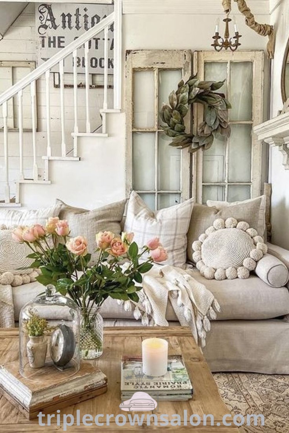A stylish farmhouse living room featuring elegant gold accents, a rustic coffee table adorned with flowers, and a warm, inviting atmosphere. This decor inspires cozy ideas, perfect for anyone looking to elevate their home