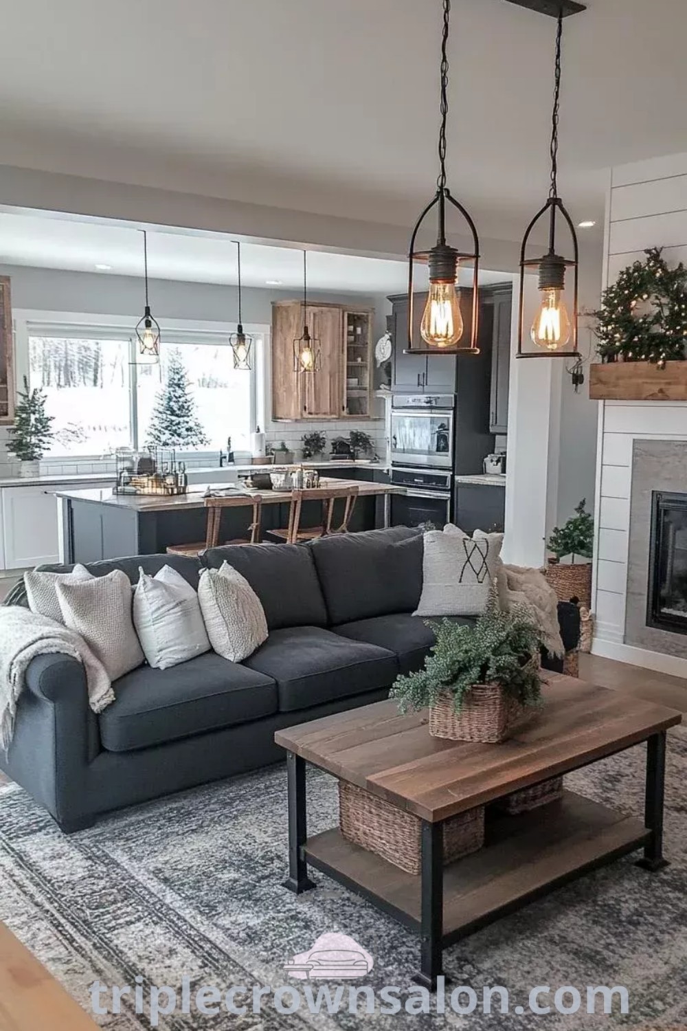 A modern farmhouse living room filled with a cozy white couch, rustic decor, and a fireplace, showcasing design ideas for an open plan layout. This inspiring space offers decor inspirations for your home and ideas you need to see, drawing on the cozy aesthetic. Find more at triplecrownsalon.com.