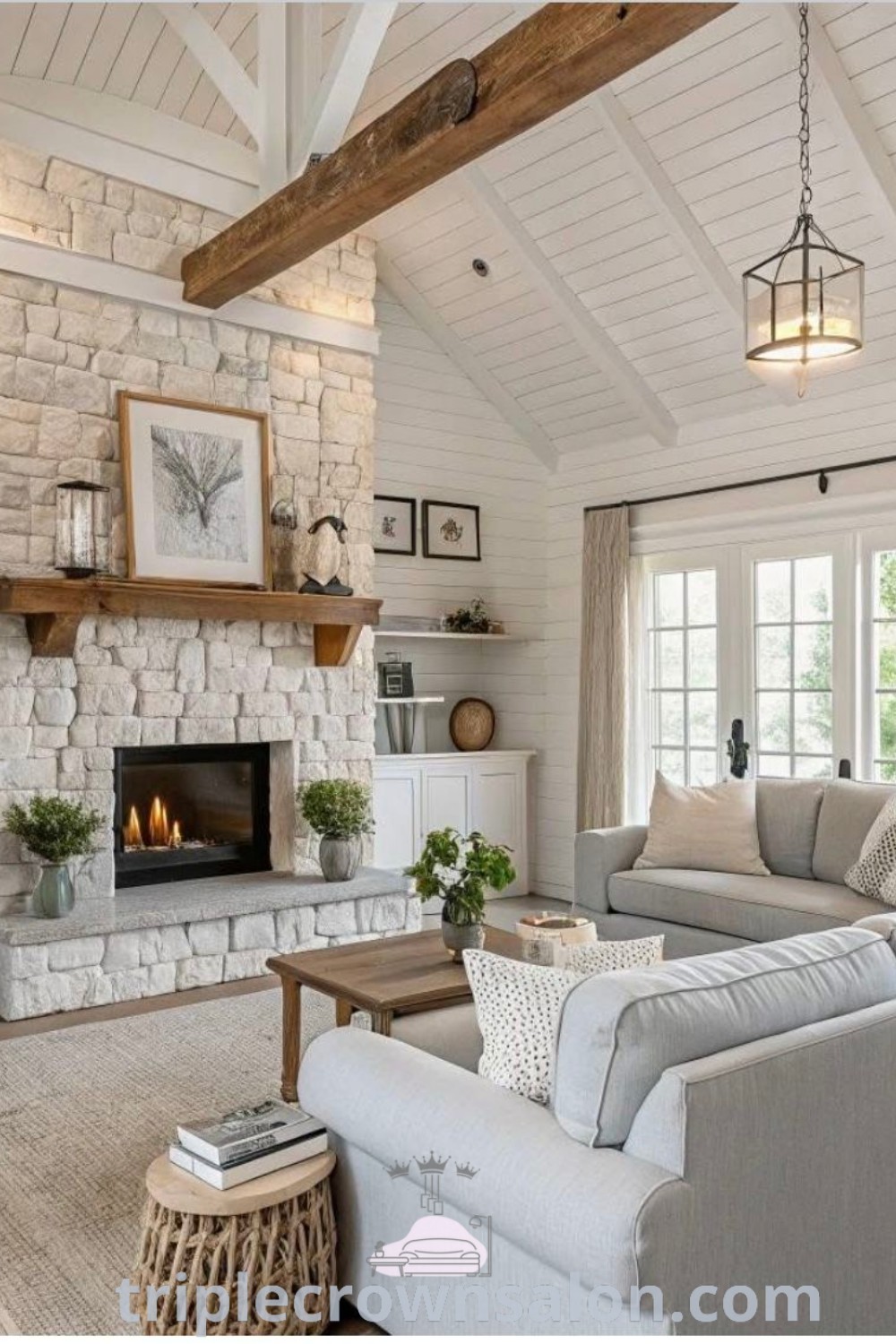 A cozy modern farmhouse living room with a fireplace, stylish furniture, and inviting decor that reflects barndominium and cottage styling. This space offers inspiring ideas for your home, blending comfort with aesthetic appeal. Discover more unique decor ideas at triplecrownsalon.com.