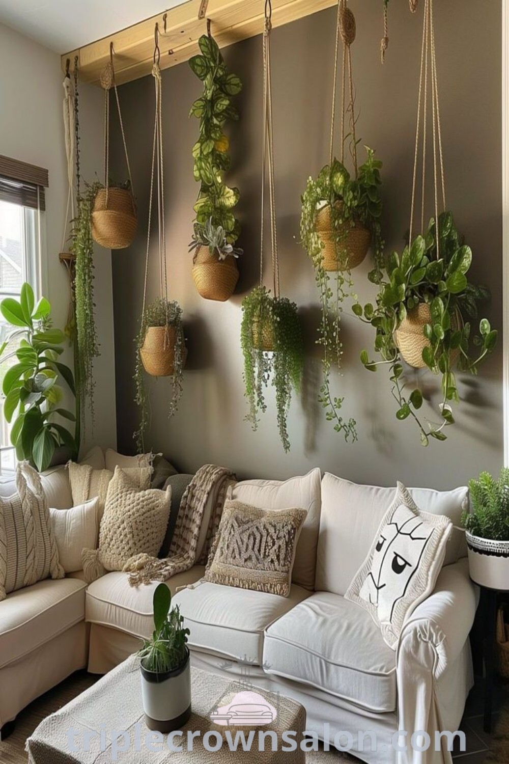 A lively living room featuring an abundance of house plants, with lush greenery hanging from the walls and couches embellished with colorful pillows, embodying cozy plant decor ideas for invigorating your home. Discover more inspirations at triplecrownsalon.com.