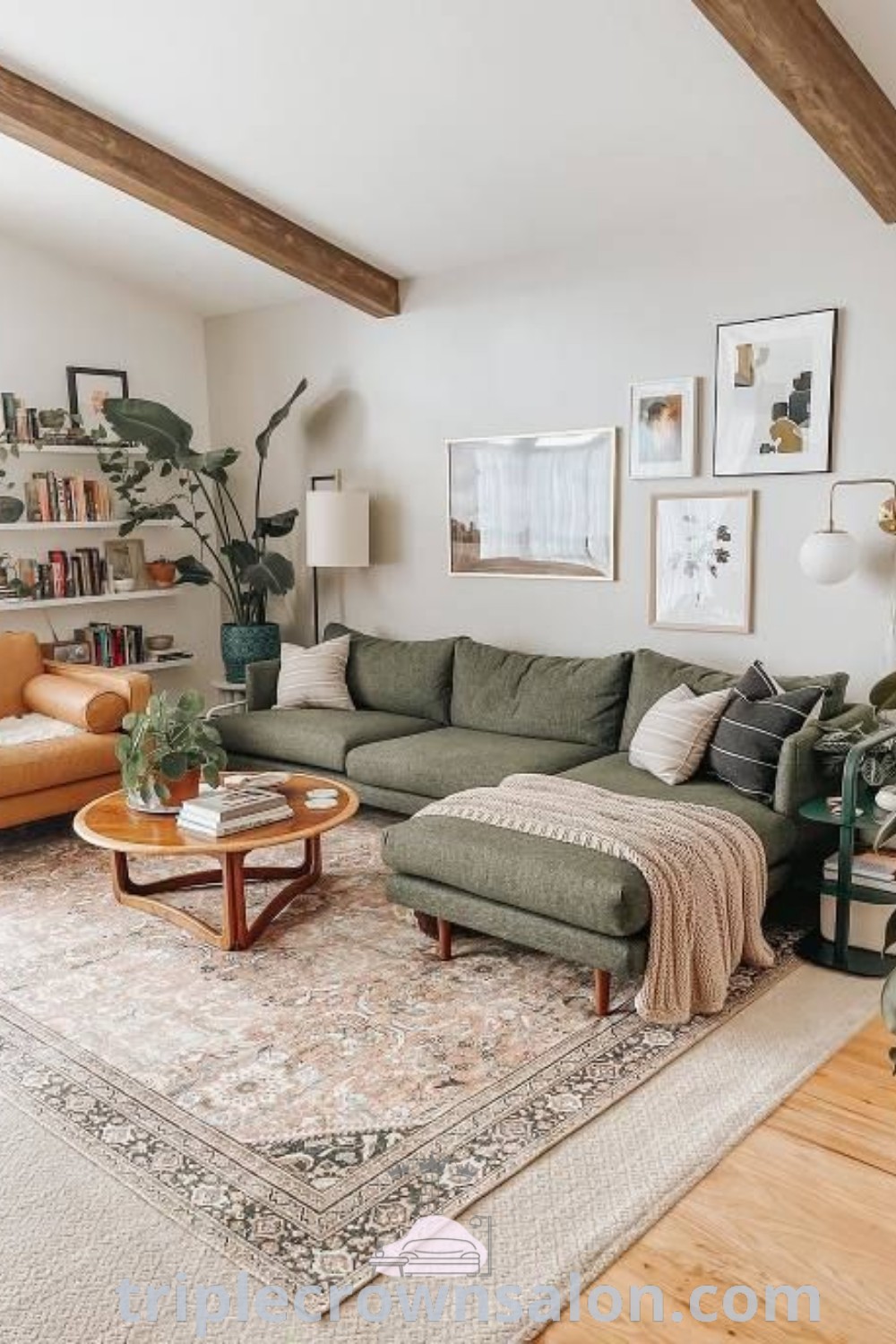 A cozy boho living room filled with furniture, vibrant plants, and a stylish rug in front of a window, showcasing unique decor ideas that inspire comfort and aesthetic. Perfect for apartment decor, the arrangement creates a warm and inviting atmosphere. Discover more inspirations at triplecrownsalon.com.