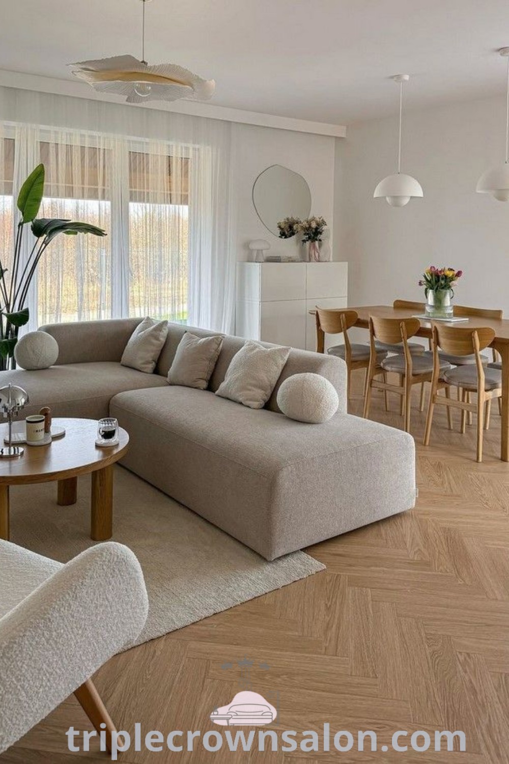 A cozy living room filled with plush furniture next to a wooden floor, reflecting Deco Living and Sydney Apartment styles. The design offers unique ideas for your home, inspiring decor for small spaces, and tips for creating a cozy aesthetic. Explore more decor ideas at triplecrownsalon.com.