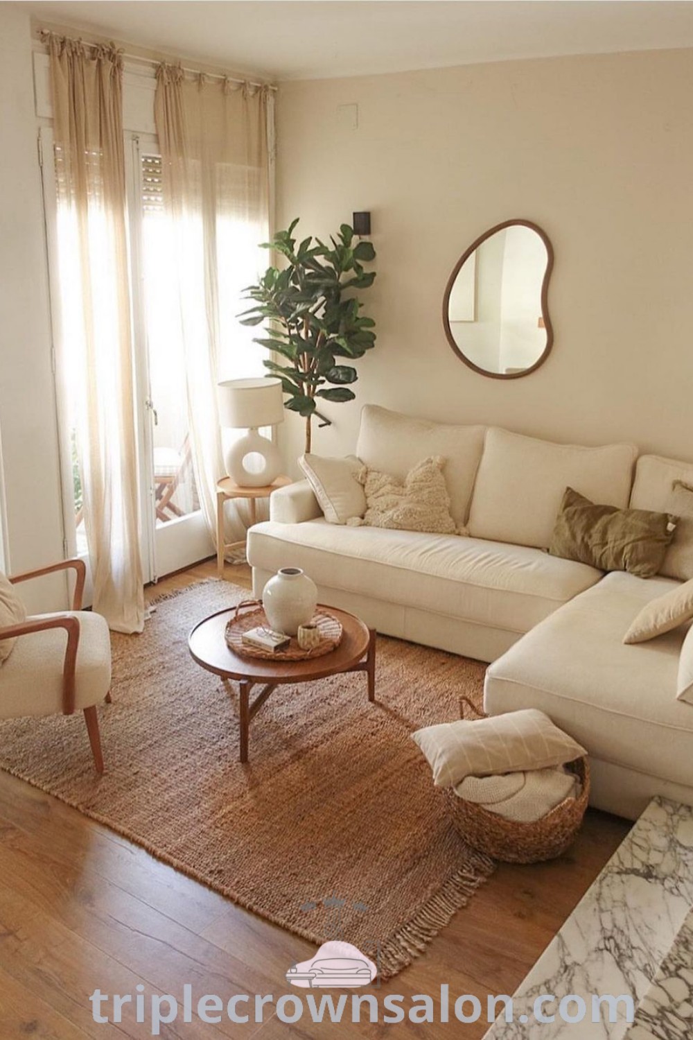 A stylish living room with cozy sofas and appealing decor, designed for entertaining guests or family. This space showcases unique ideas for modern apartment living, blending functionality with a cozy aesthetic. Discover more decor ideas for your home at triplecrownsalon.com.