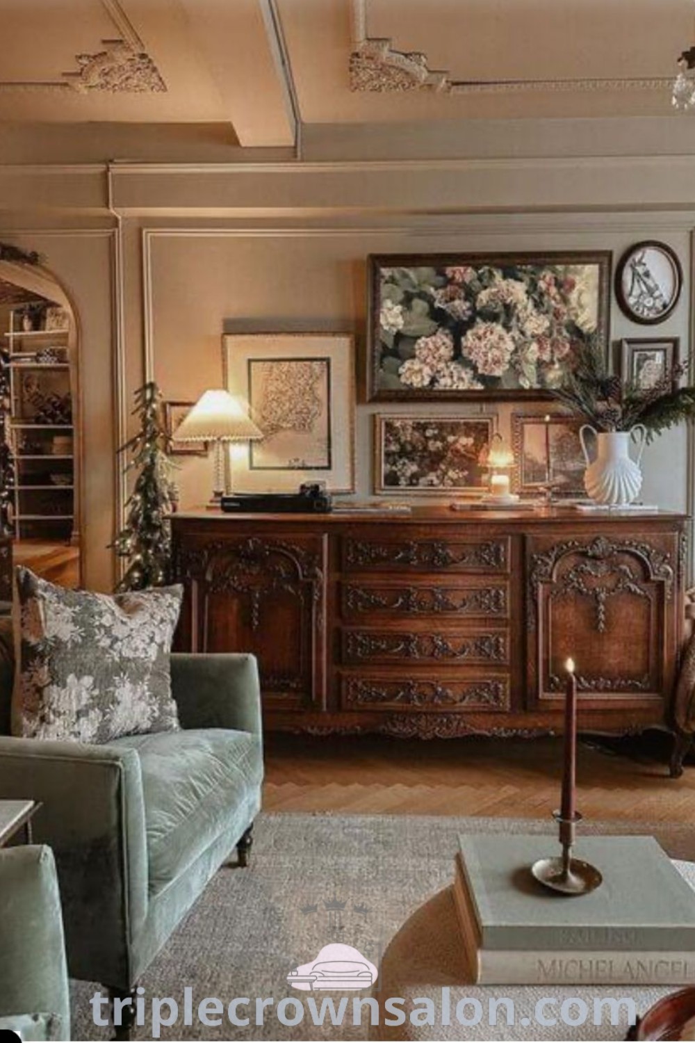 An antique-inspired living room with vintage furniture and historical decor that captures the romantic academia aesthetic. This cozy home design showcases a moody English cottage vibe, offering inspiring decor ideas for small spaces. Explore more at triplecrownsalon.com.