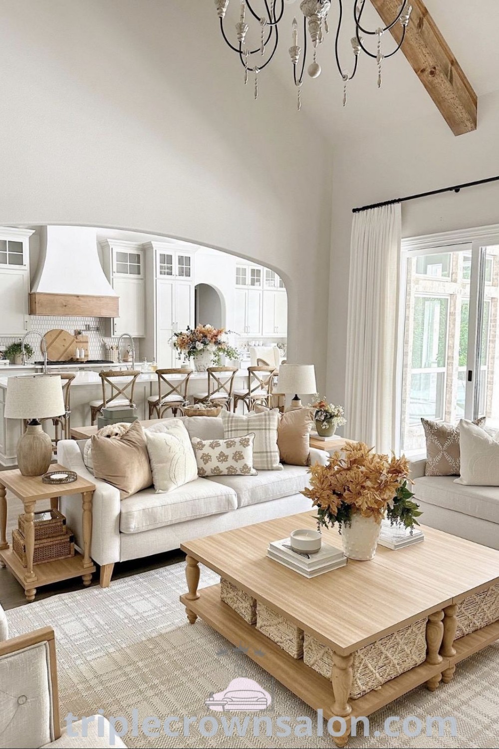 A luxurious living room filled with elegant furniture and a beautiful chandelier, showcasing Spanish inspired decor amidst cozy ideas and design inspirations for a Qatar apartment or Texas house. Discover unique decor ideas for your home at triplecrownsalon.com.